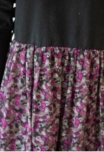 Black top and floral bottom dress