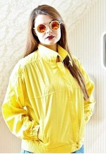 Bright yellow vintage lightweight raincoat jacket